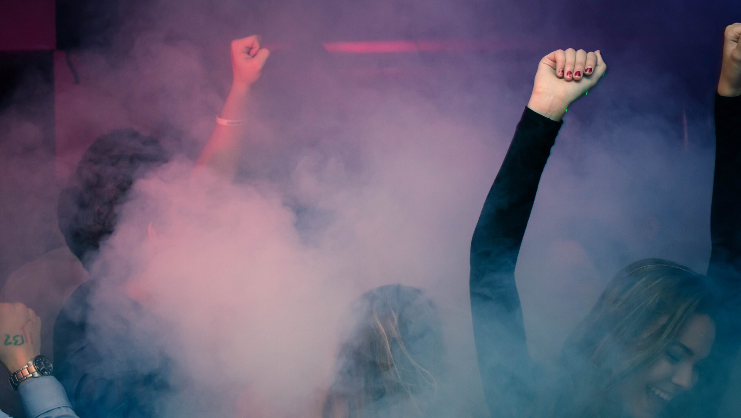 Woman Wearing Black Long-sleeved Shirt Dancing With Smoke